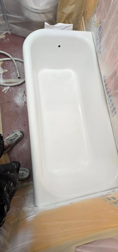 reglazer contractor standing by tub