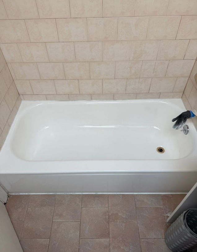 Reglazed tub by tile wall